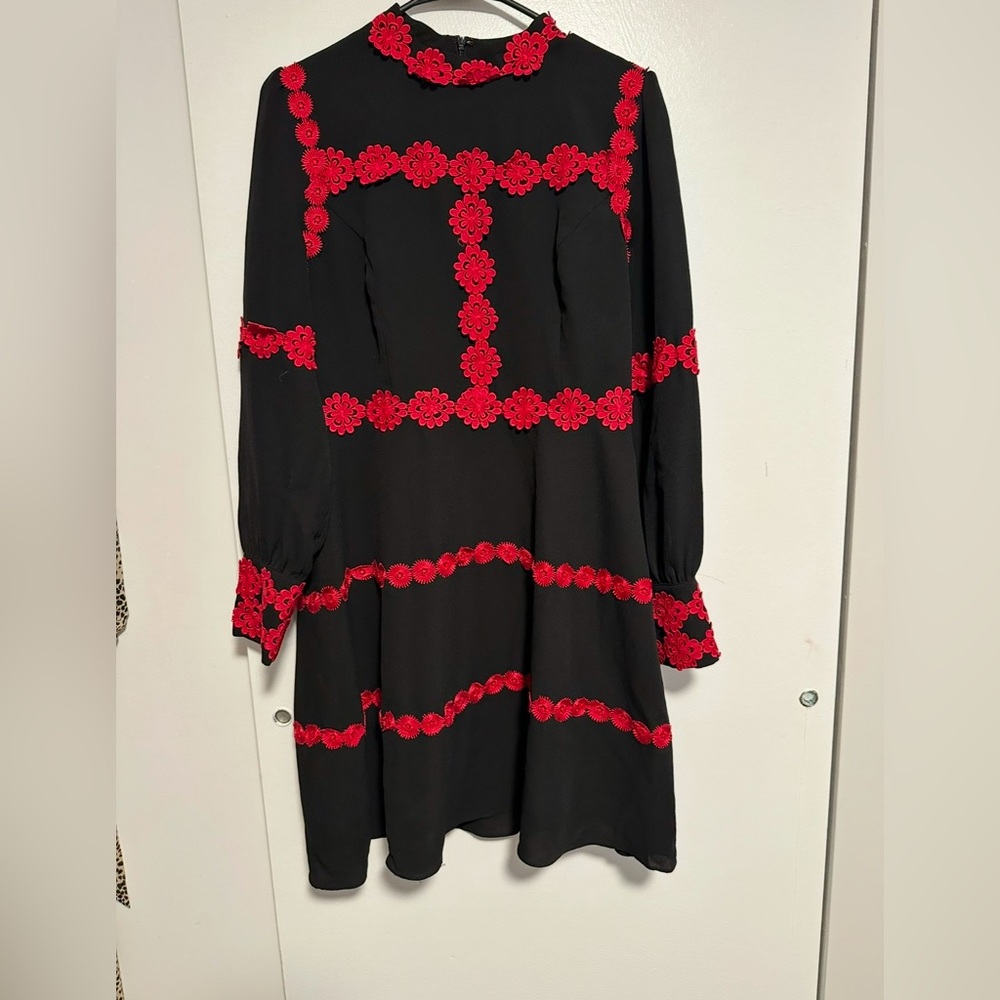 Black lined dress with Magenta flowers boarder.
